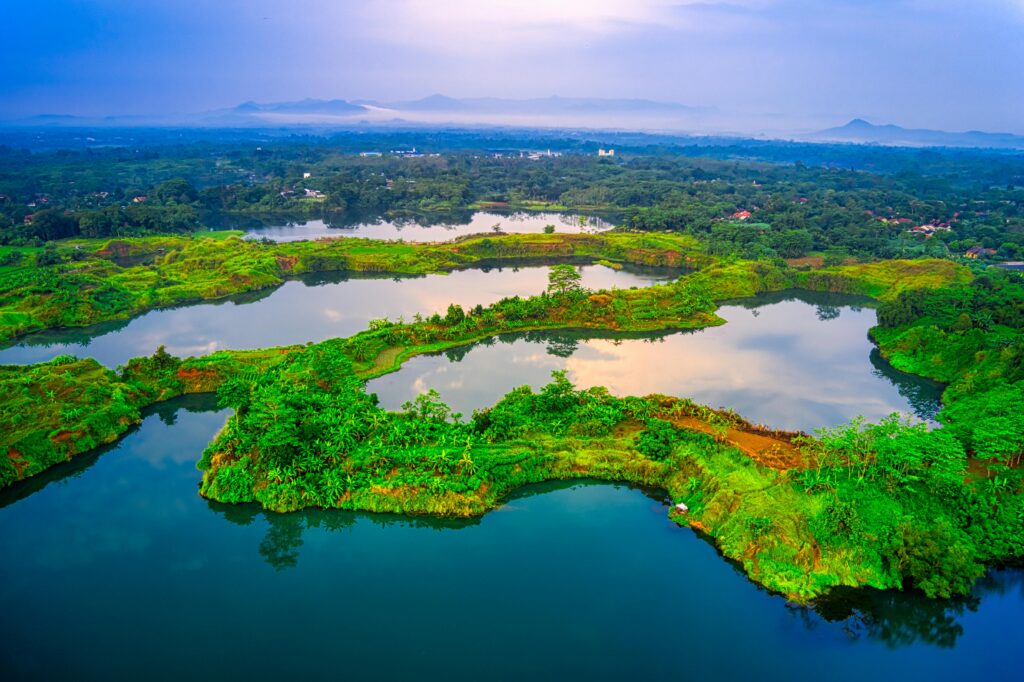 Scenic aerial view of lush green islands and lakes in Banten, Indonesia.