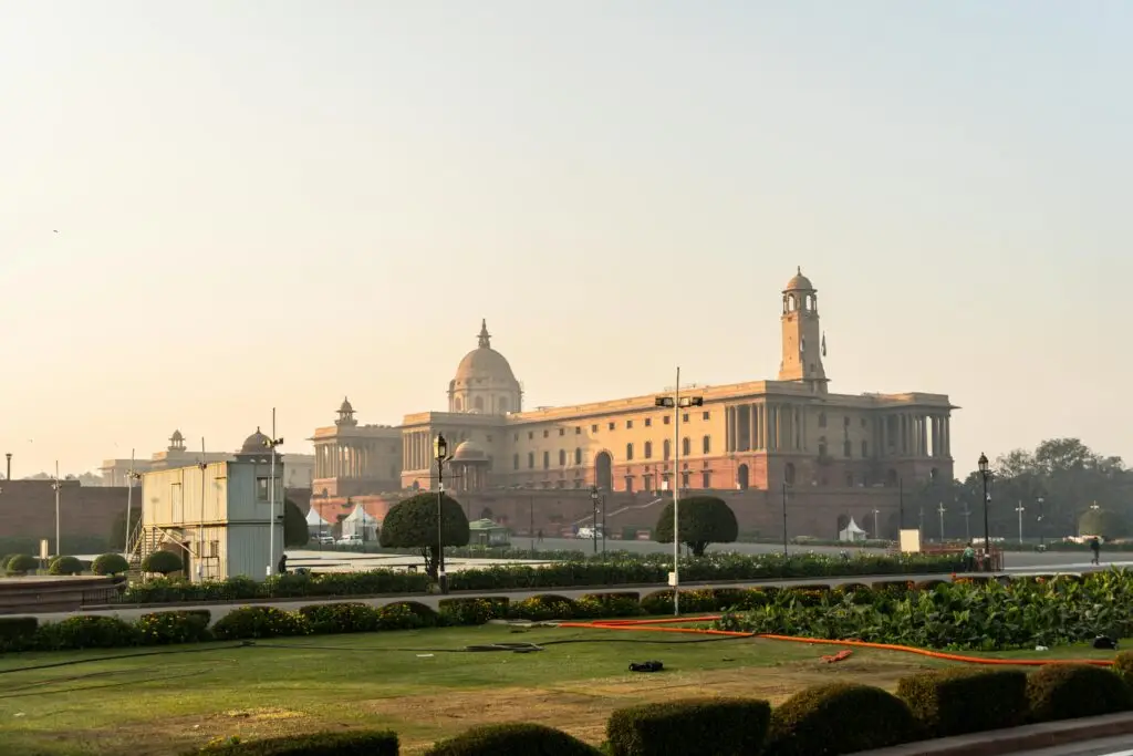 Indian Polity Stunning view of Rashtrapati Bhavan with a clear sky in New Delhi, India, during sunrise.